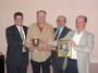 Emery Currier Presents Cup to Past and Present Race Directors. (Shown L to R: Doug Lucente, Emery Currier, John Lucente, Jim Shimansky)